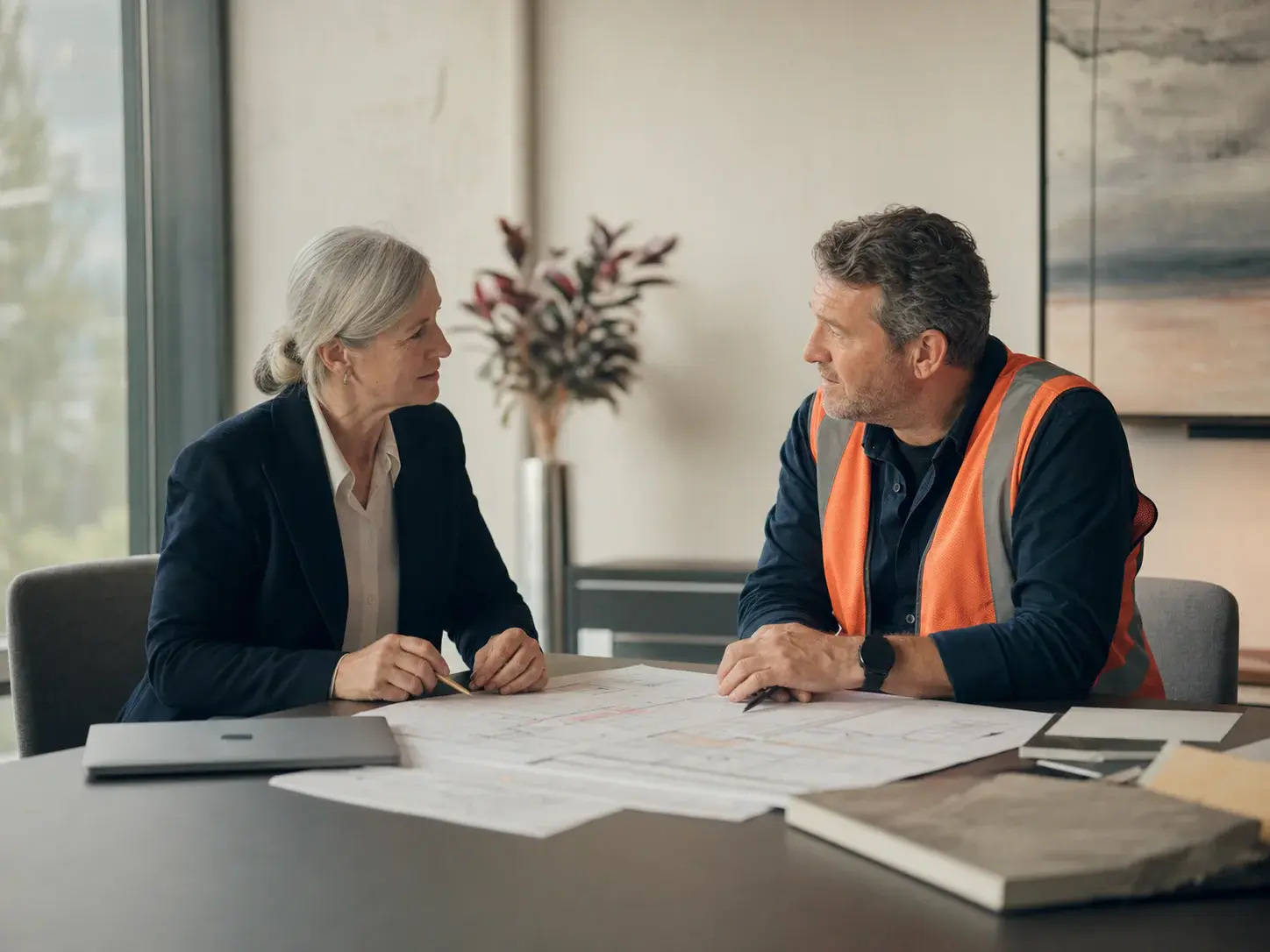 A talent advisor discussing a staffing plan with a construction leader
